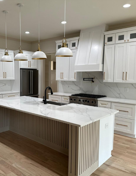 luxury kitchen with white cabinets and countertops